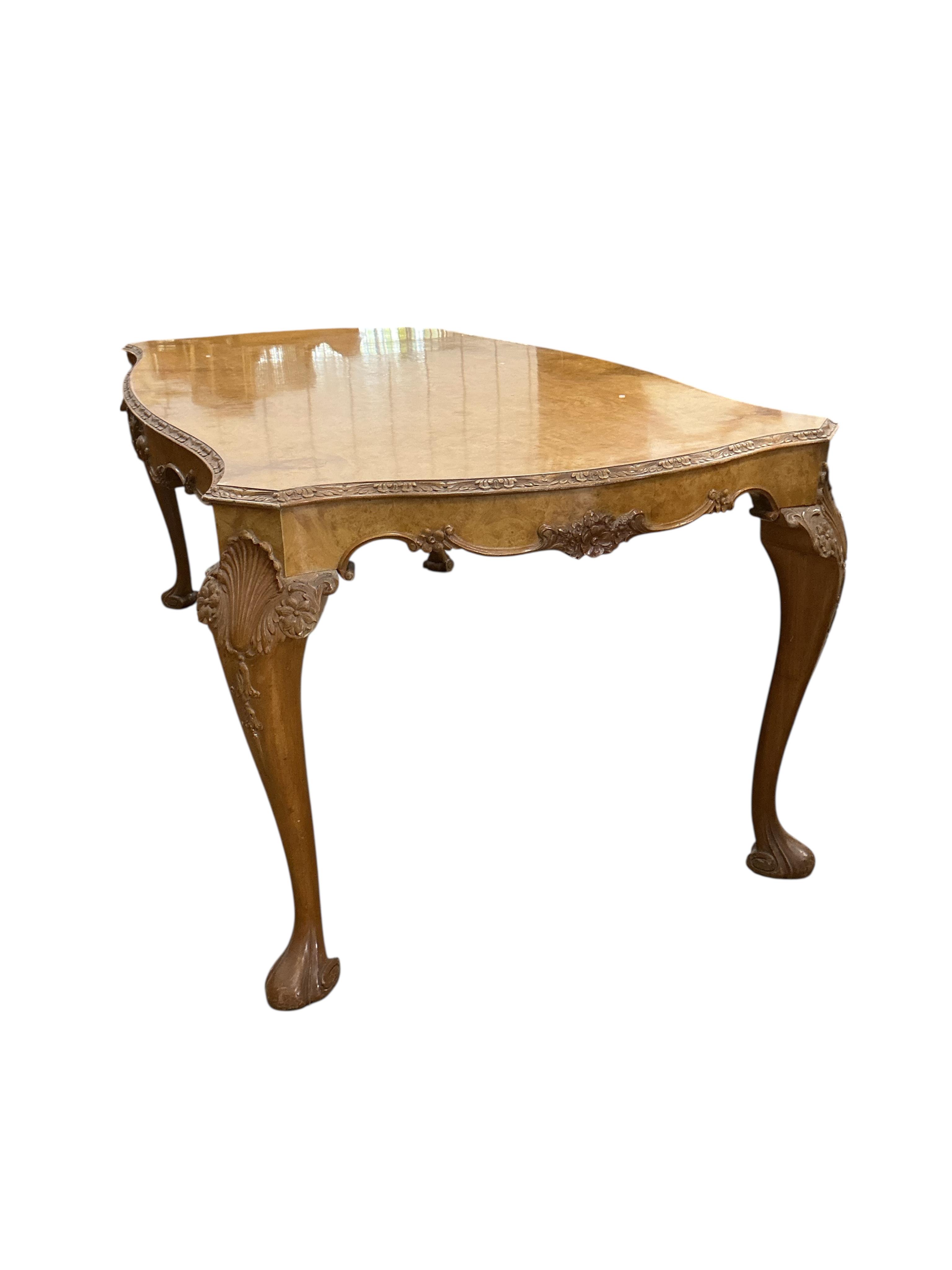 A Queen Anne Revival rectangular walnut dining table, width 210cm, depth 104cm, height 76cm together with six matching upholstered dining chairs